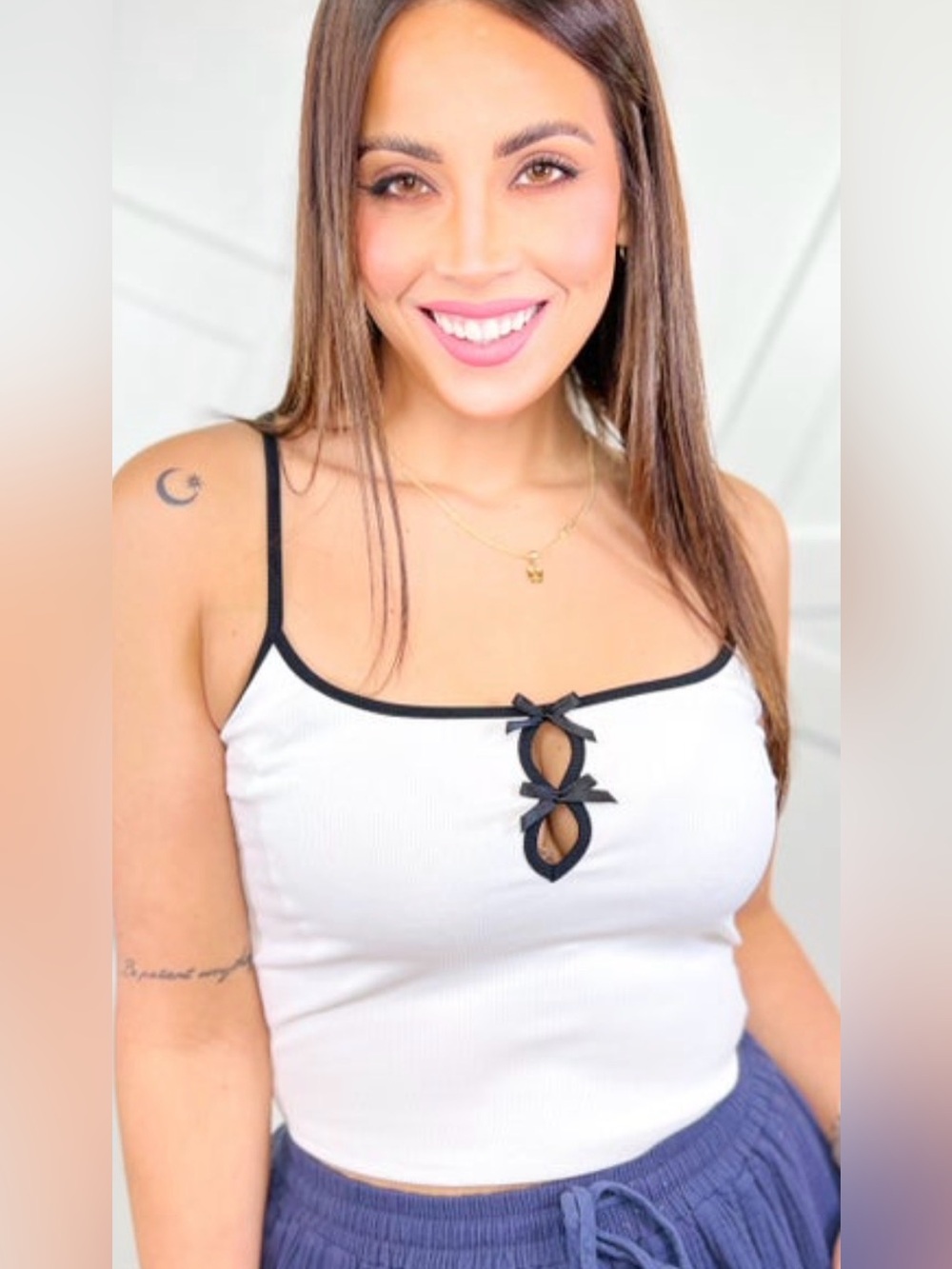 White Ribbed Tank Top with Black Trim and Bow Accents
